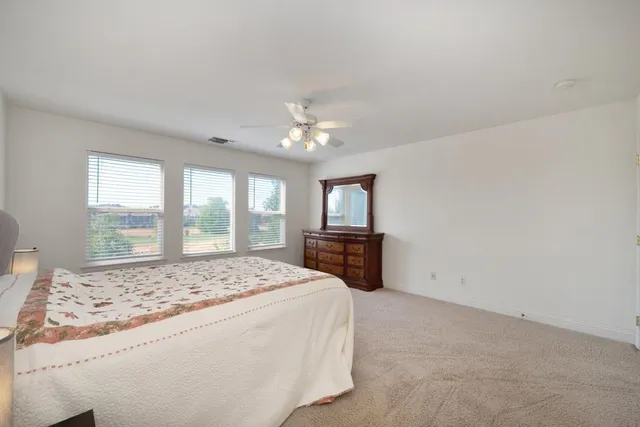 a view of a yard with a trampoline