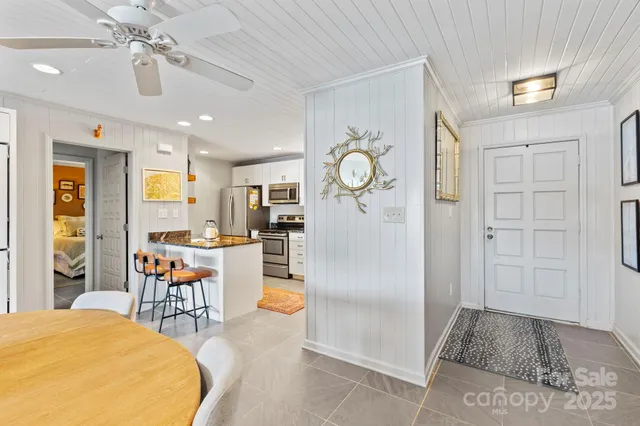 a kitchen with stainless steel appliances granite countertop a sink stove and microwave