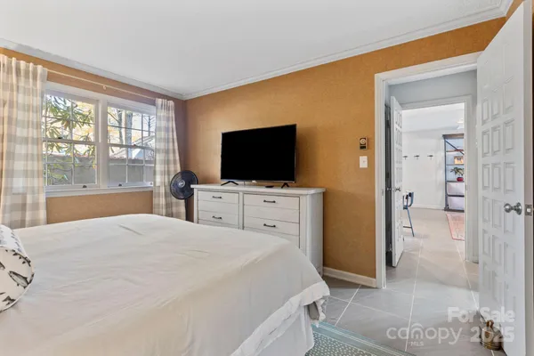 a bathroom with a granite countertop sink and a toilet