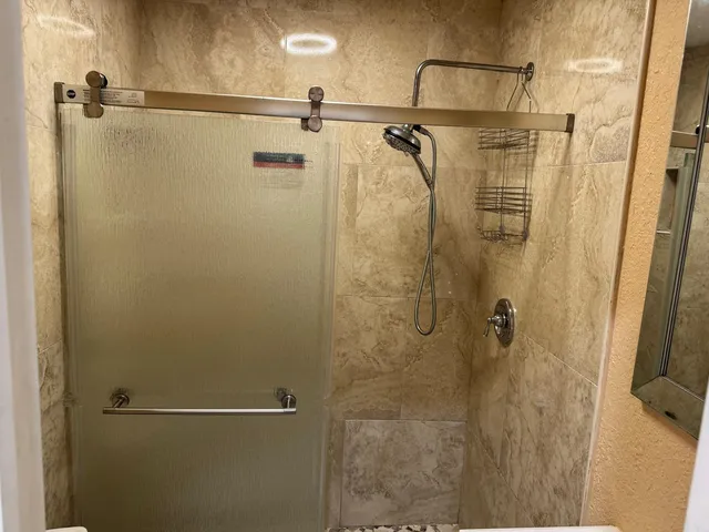 a white toilet sitting next to a bathroom sink