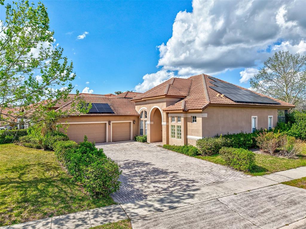 918 Algare Loop Windermere, FL 34786 - Photo 72 of 73 a front view of a house with a yard and trees