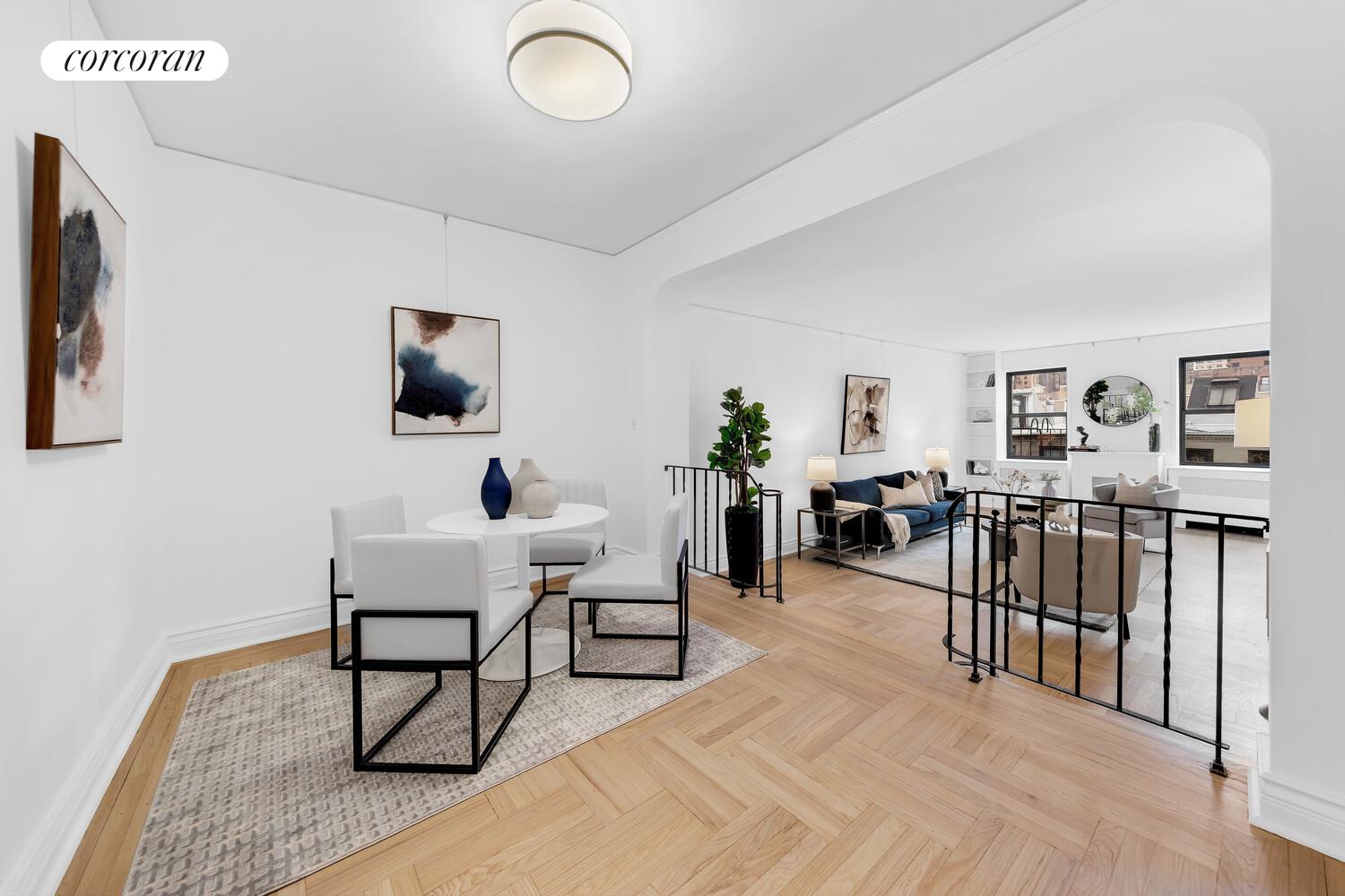 225 East 74th Street, Unit 5A Manhattan, NY 10021 - Photo 2 of 7 a living room with furniture and a flat screen tv