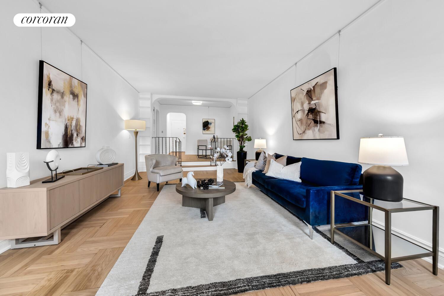 225 East 74th Street, Unit 5A Manhattan, NY 10021 - Photo 3 of 7 a living room with furniture and a lamp