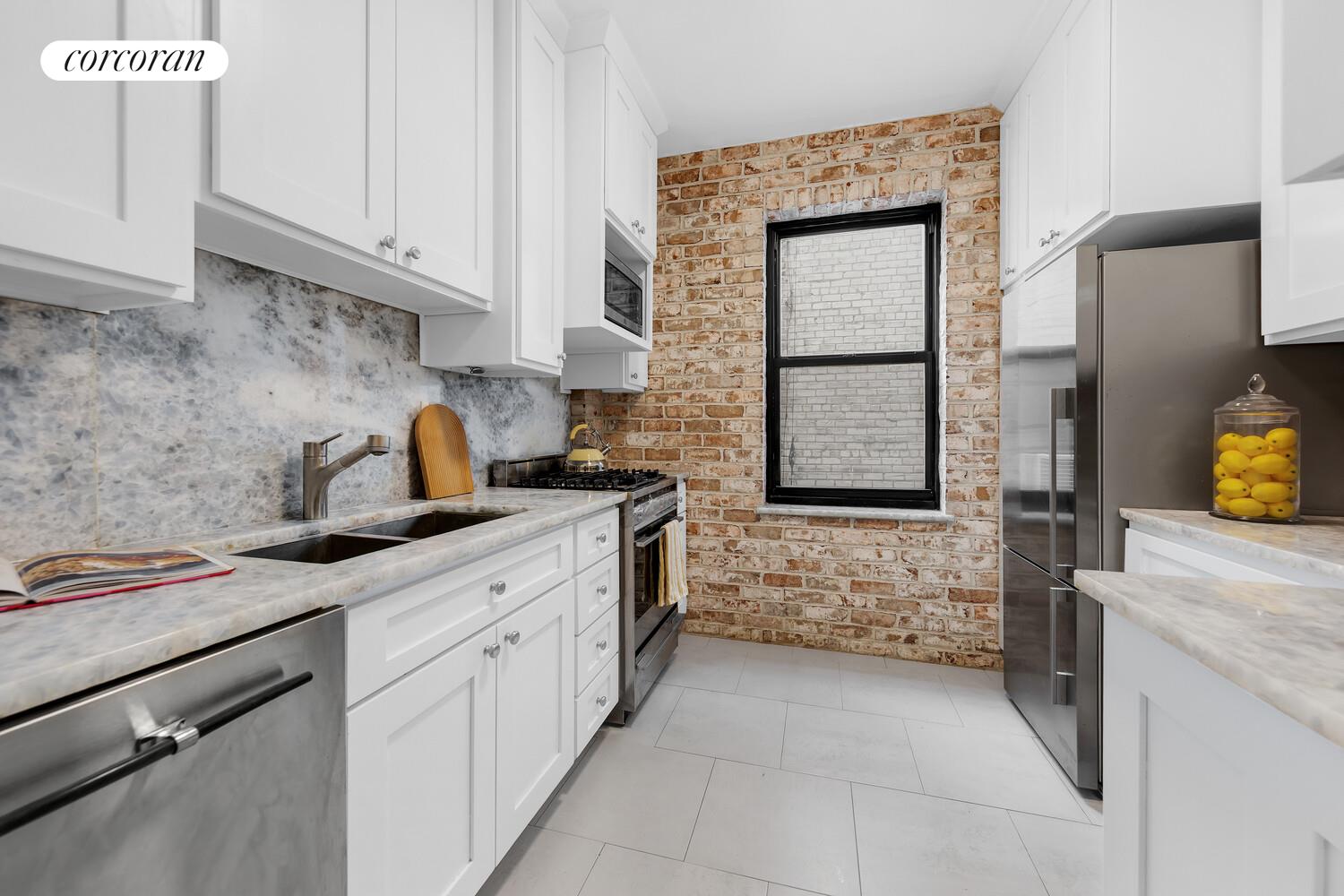 225 East 74th Street, Unit 5A Manhattan, NY 10021 - Photo 5 of 7 a kitchen with a sink stove and cabinets