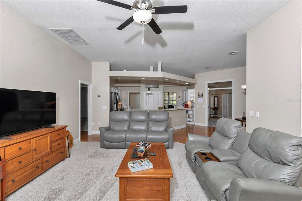 1989 Northwest 111th Loop Ocala, FL 34475 - Photo 18 of 55 a living room with furniture and a flat screen tv