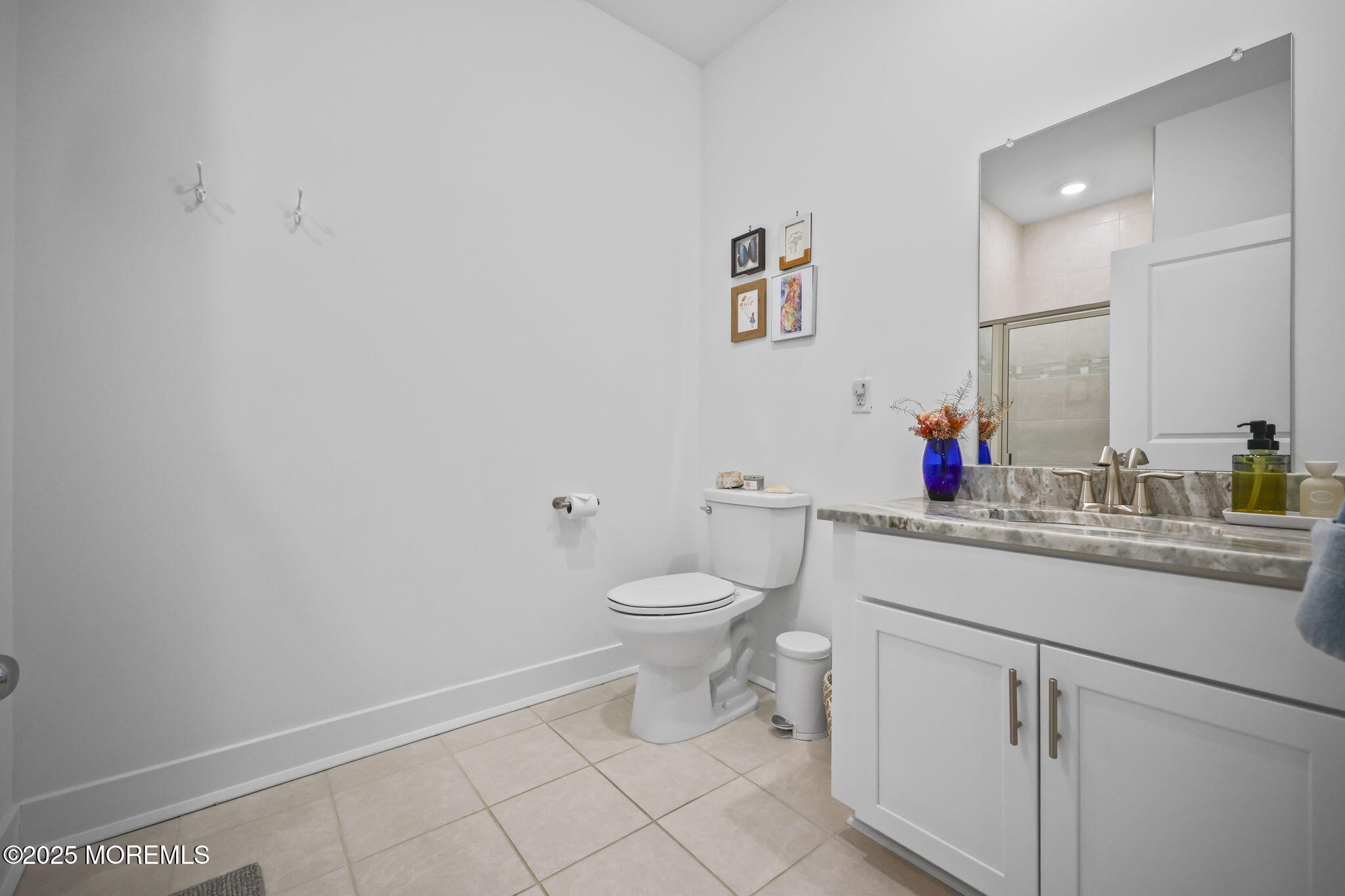 43 Midway Road North Tinton Falls, NJ 07724 - Photo 13 of 20 a bathroom with a toilet sink and mirror