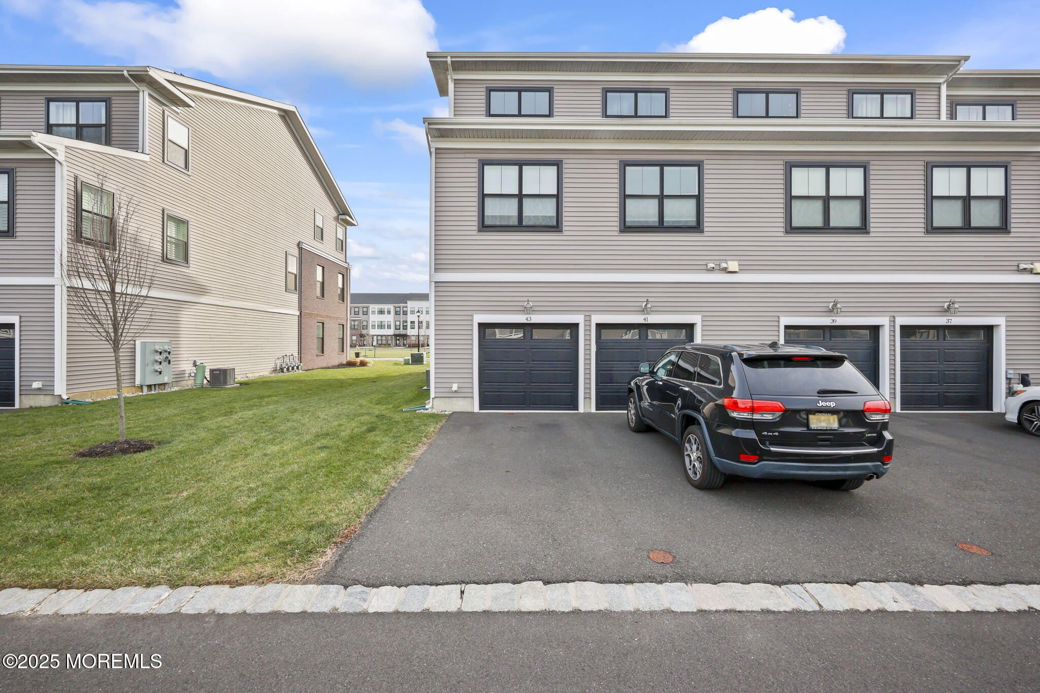 43 Midway Road North Tinton Falls, NJ 07724 - Photo 19 of 20 a car parked in front of a brick house