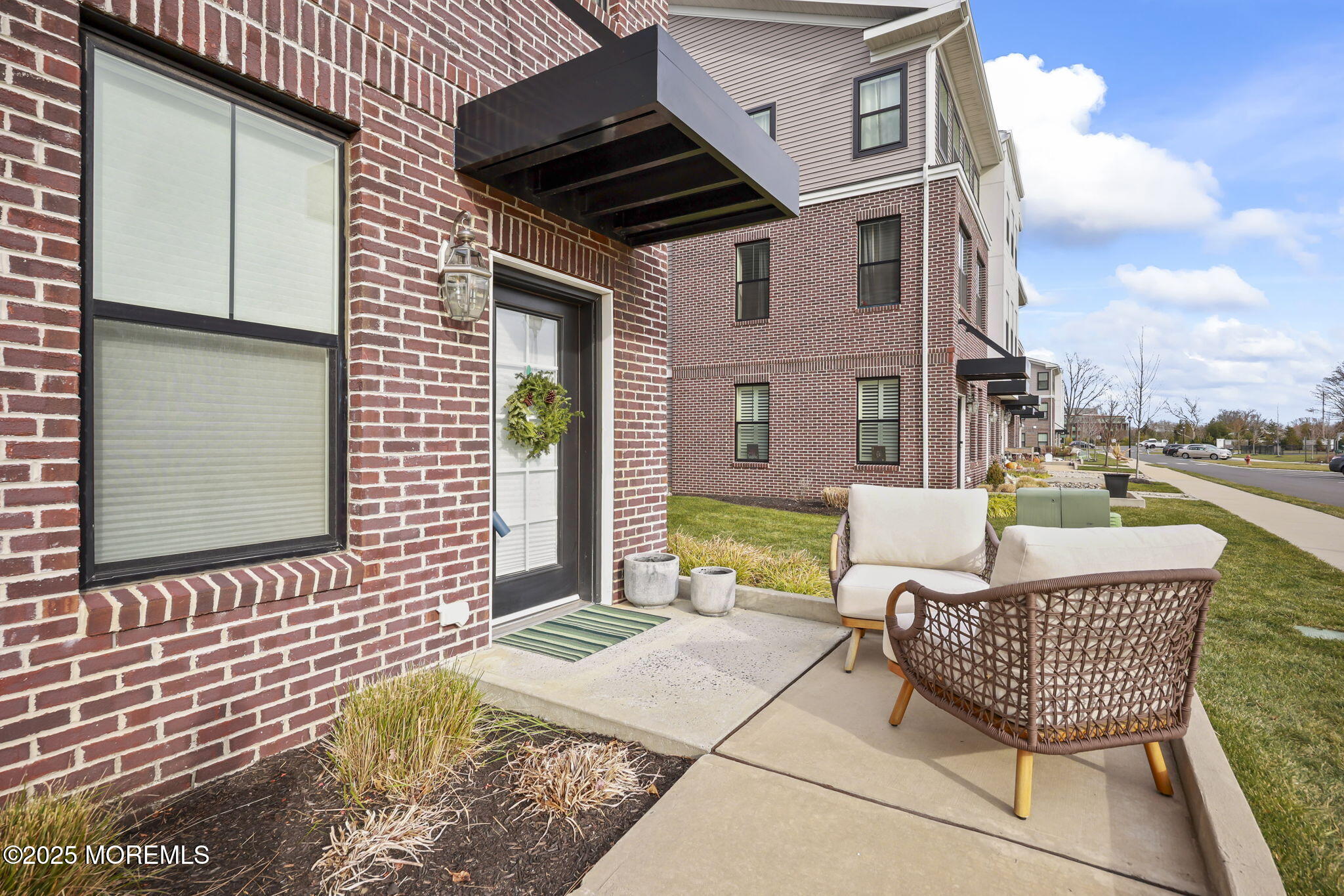43 Midway Road North Tinton Falls, NJ 07724 - Photo 3 of 20 a view of a patio with couches chairs and wooden floor