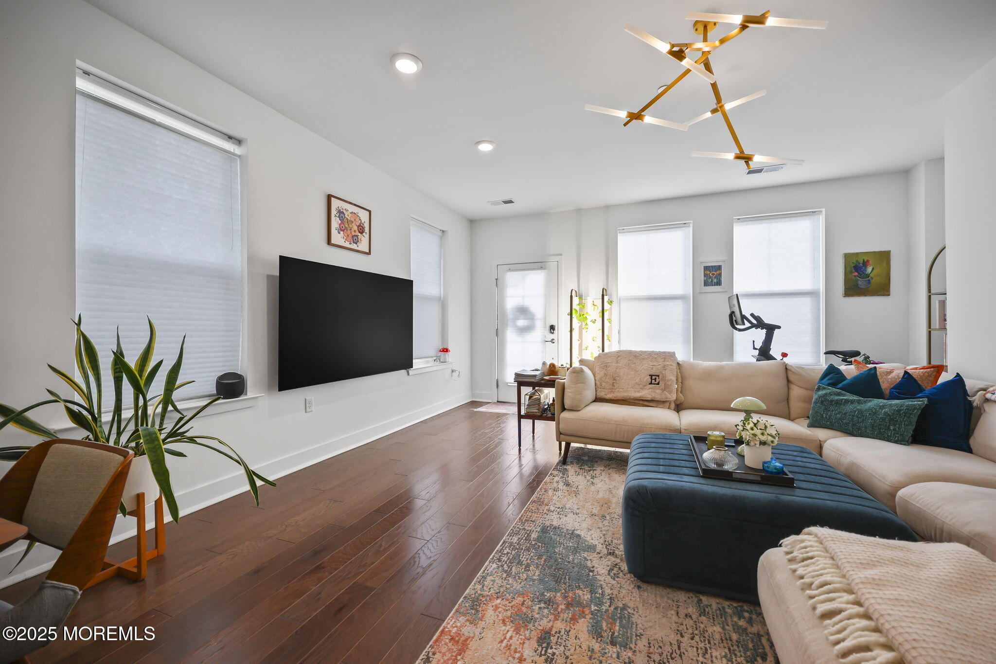 43 Midway Road North Tinton Falls, NJ 07724 - Photo 5 of 20 a living room with furniture a ceiling fan and a flat screen tv