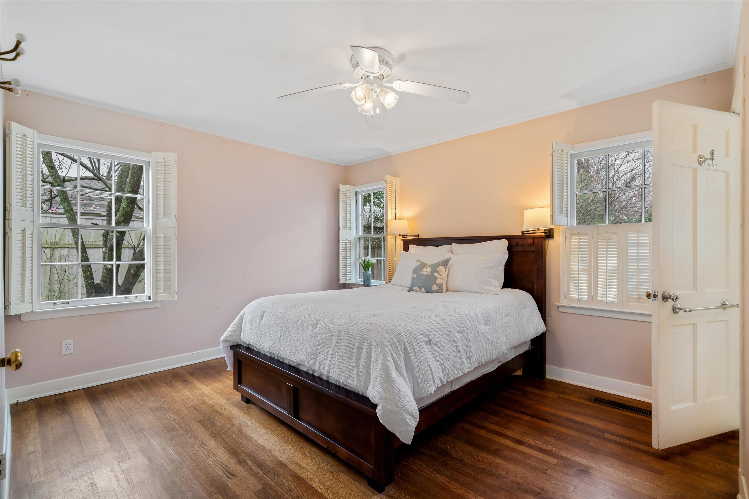 317 Pidgeon Road Memphis, TN 38117 - Photo 18 of 25 a bedroom with a large bed chandelier and a window