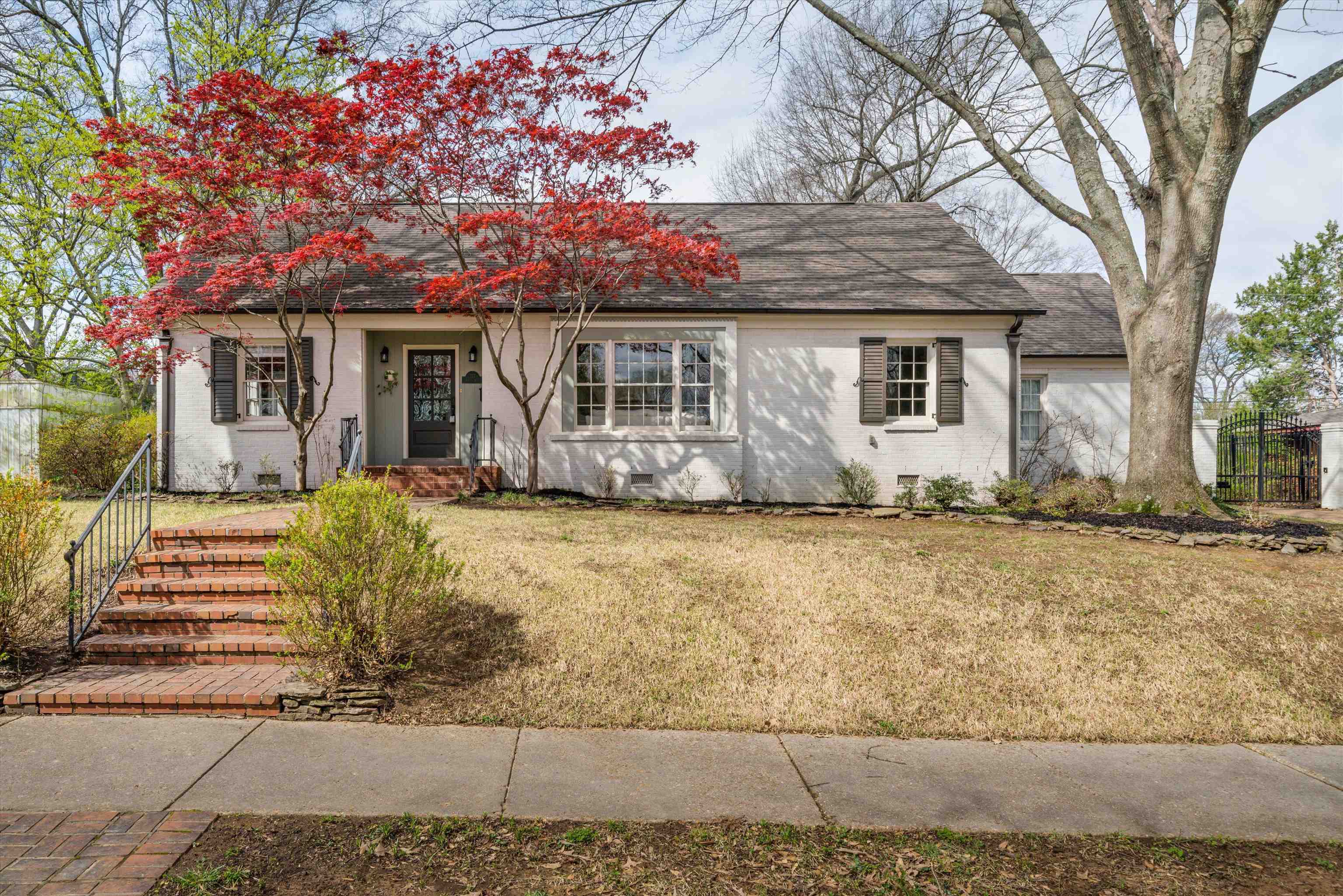 317 Pidgeon Road Memphis, TN 38117 - Photo 2 of 25 a front view of a house with a yard