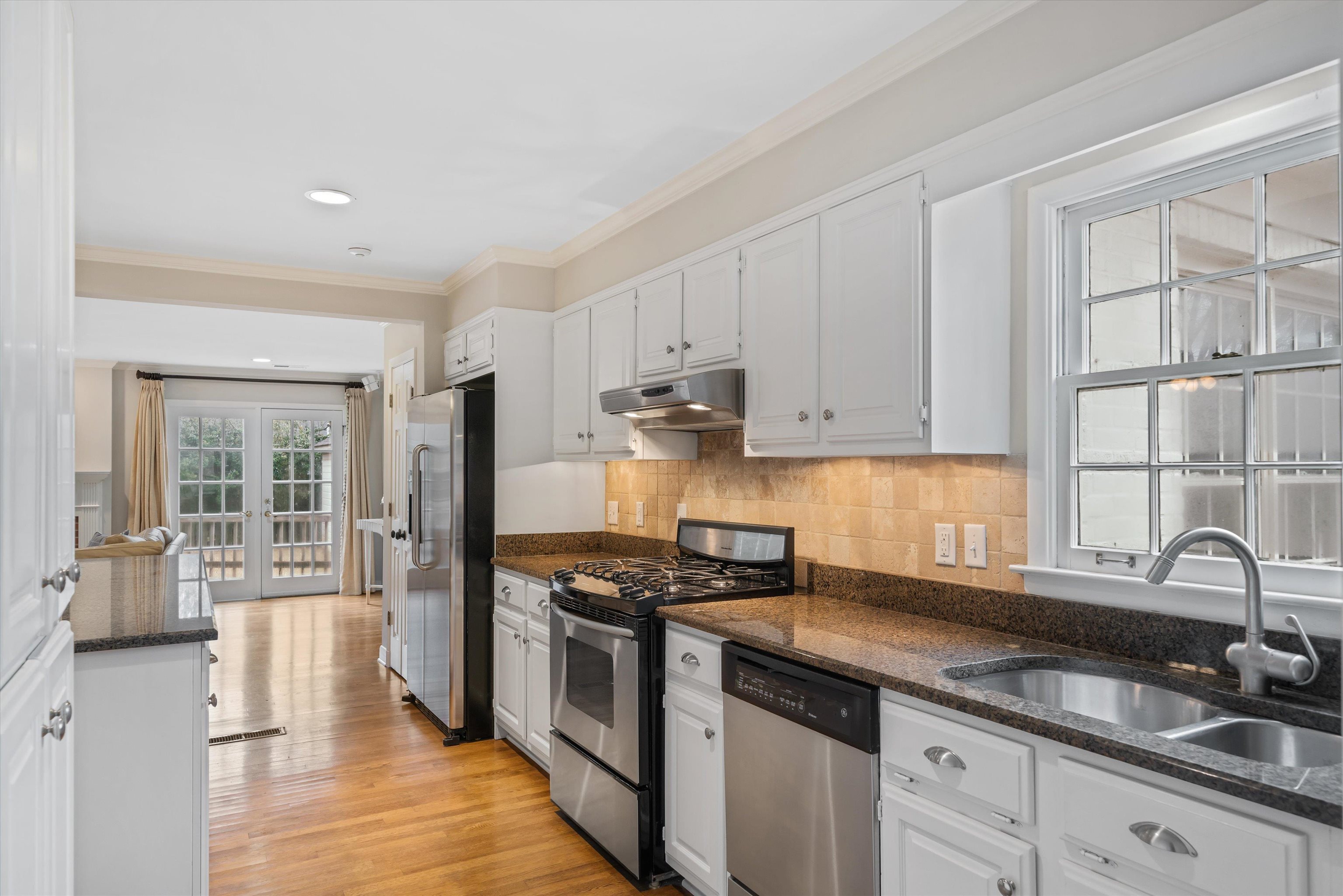 317 Pidgeon Road Memphis, TN 38117 - Photo 8 of 25 a kitchen with granite countertop a sink stainless steel appliances and cabinets