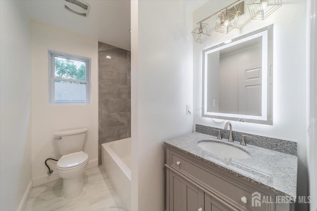 17 4th Street Hillsborough, NJ 08821 - Photo 24 of 33 a bathroom with a granite countertop sink toilet and shower