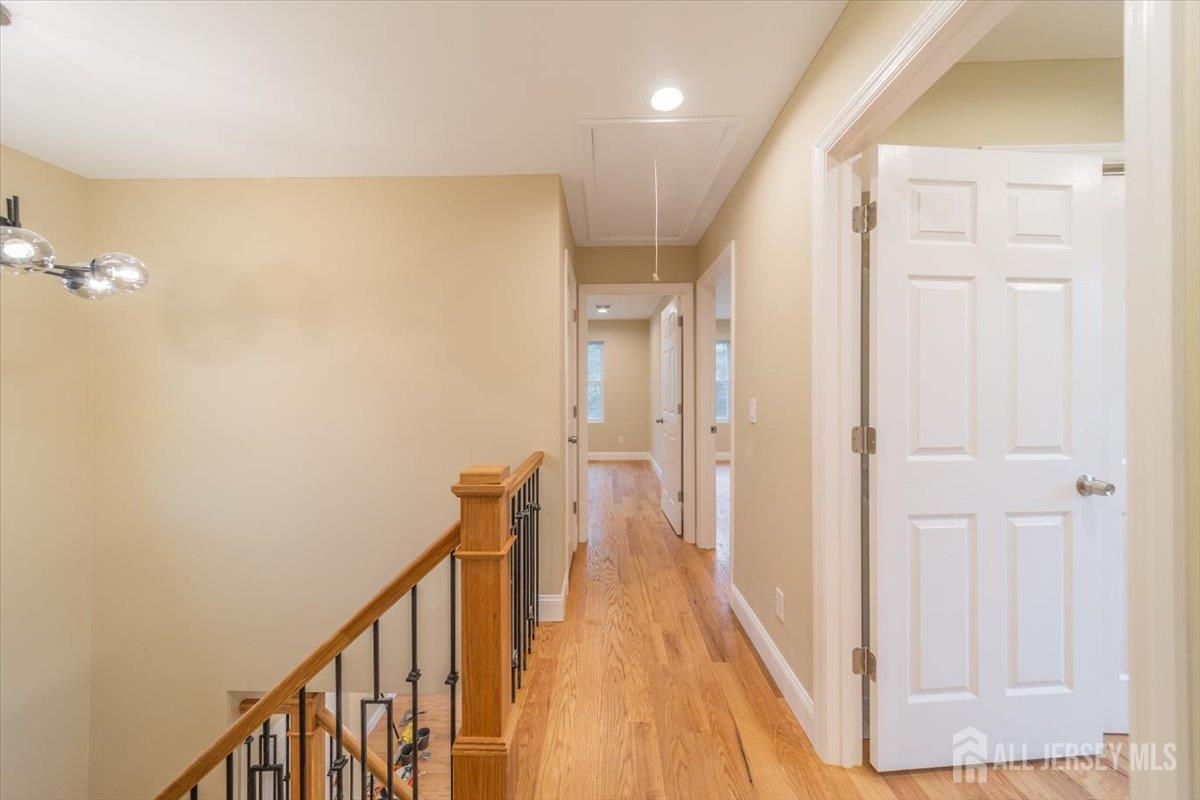 17 4th Street Hillsborough, NJ 08821 - Photo 25 of 33 a view of a hallway with wooden floor and staircase