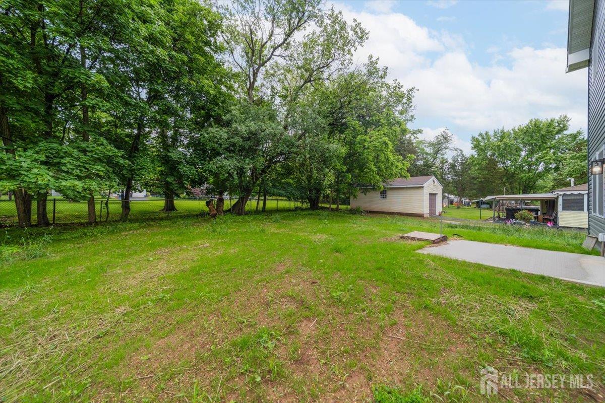 17 4th Street Hillsborough, NJ 08821 - Photo 28 of 33 a view of house with garden space and trees