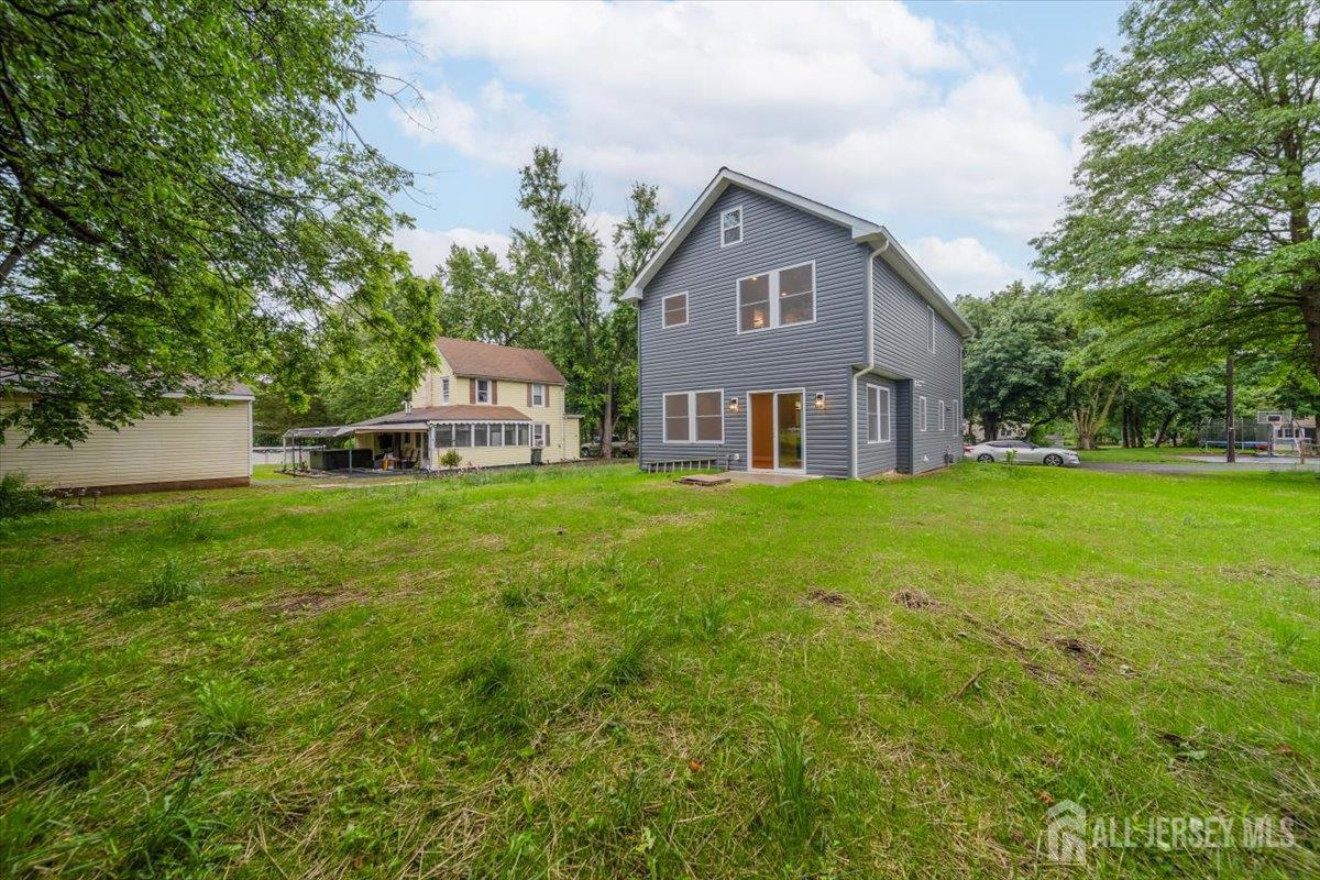 17 4th Street Hillsborough, NJ 08821 - Photo 29 of 33 a front view of a house with yard and green space