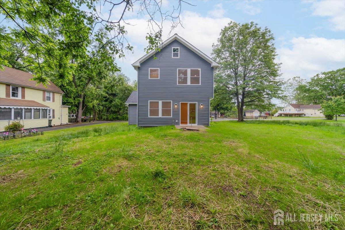 17 4th Street Hillsborough, NJ 08821 - Photo 30 of 33 a front view of a house with a yard and trees