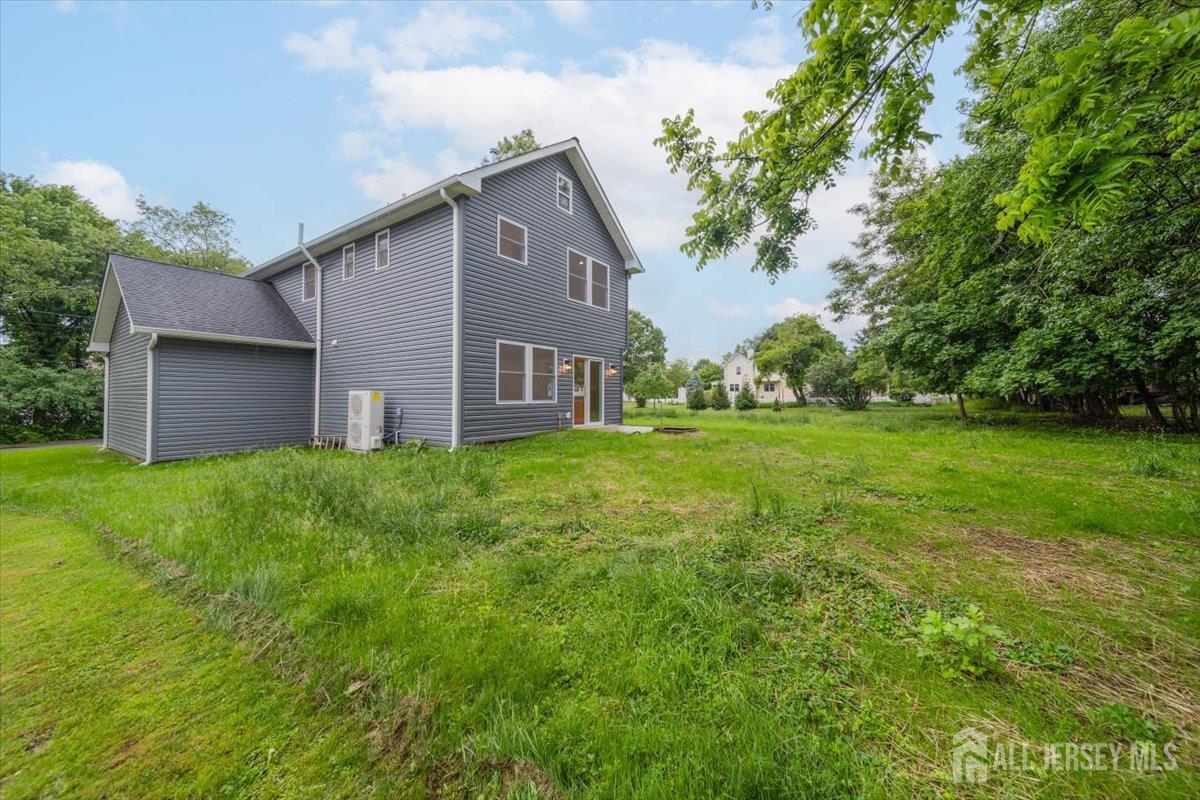 17 4th Street Hillsborough, NJ 08821 - Photo 31 of 33 a backyard of a house with lots of green space
