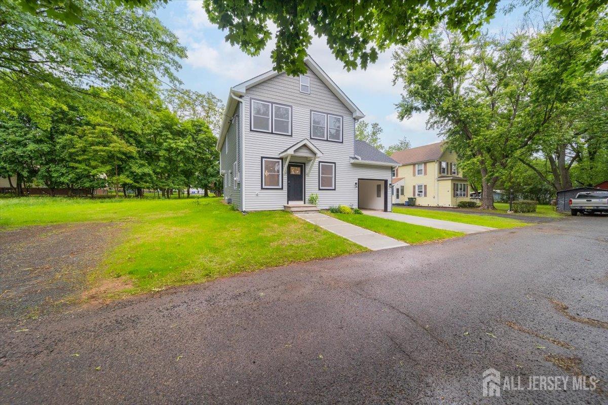 17 4th Street Hillsborough, NJ 08821 - Photo 32 of 33 a view of a house with a big yard and large trees