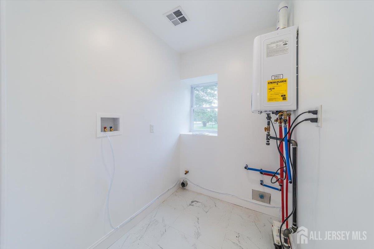 17 4th Street Hillsborough, NJ 08821 - Photo 9 of 33 a view of an entryway with wooden floor