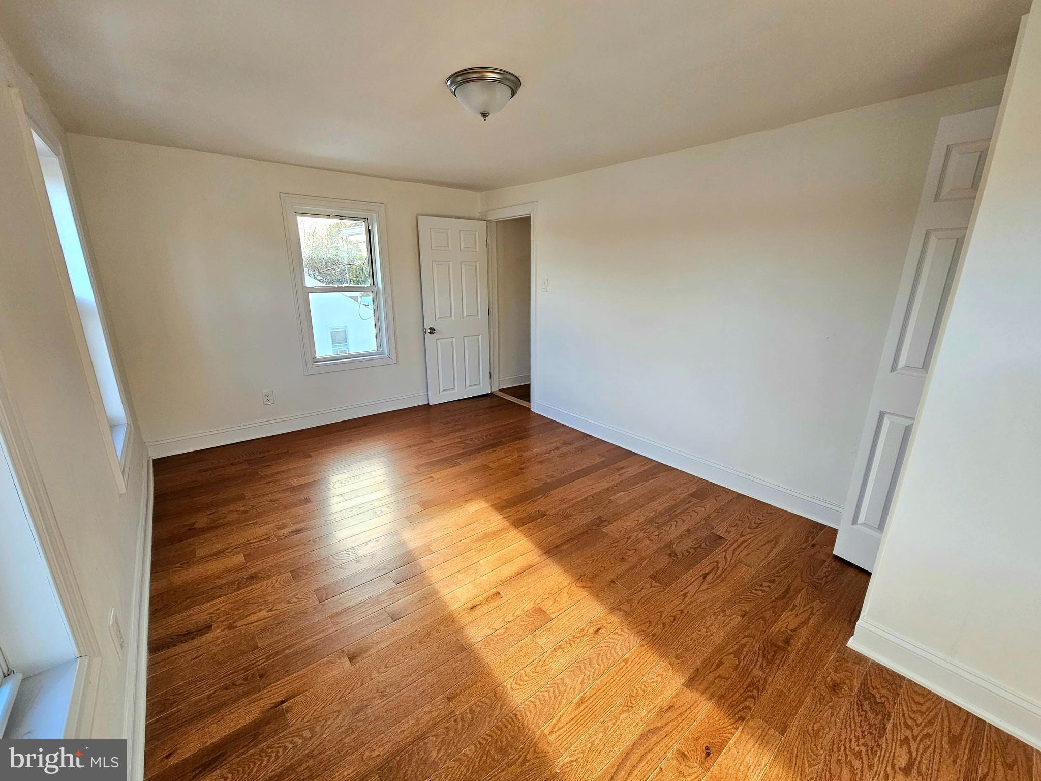 332 East Linden Avenue Lindenwold, NJ 08021 - Photo 18 of 25 a view of empty room with wooden floor and fan