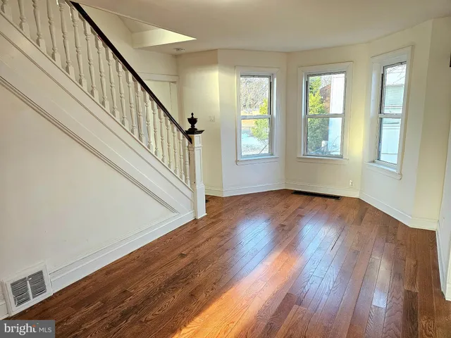 a view of an entryway with wooden floor