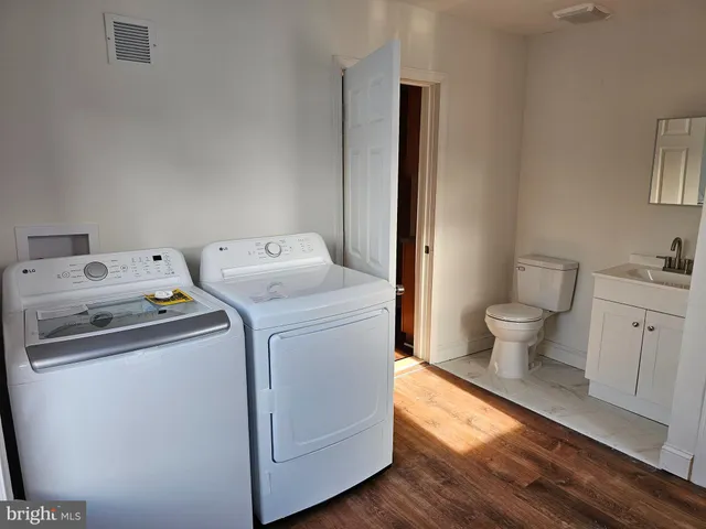 a utility room with dryer and washer