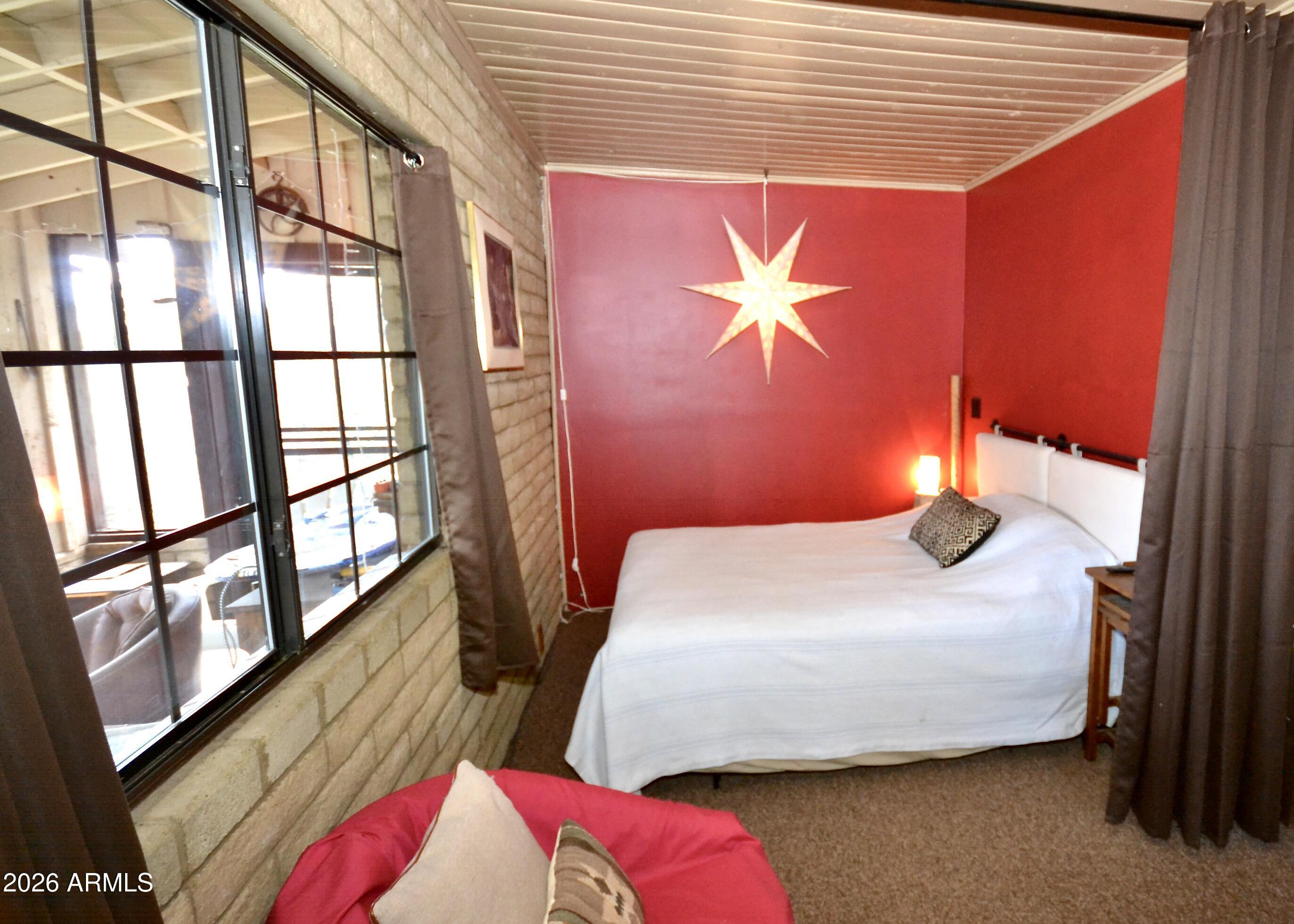 23617 South Demascus Road Crown King, AZ 86343 - Photo 21 of 50 a bedroom with a bed and a mirror
