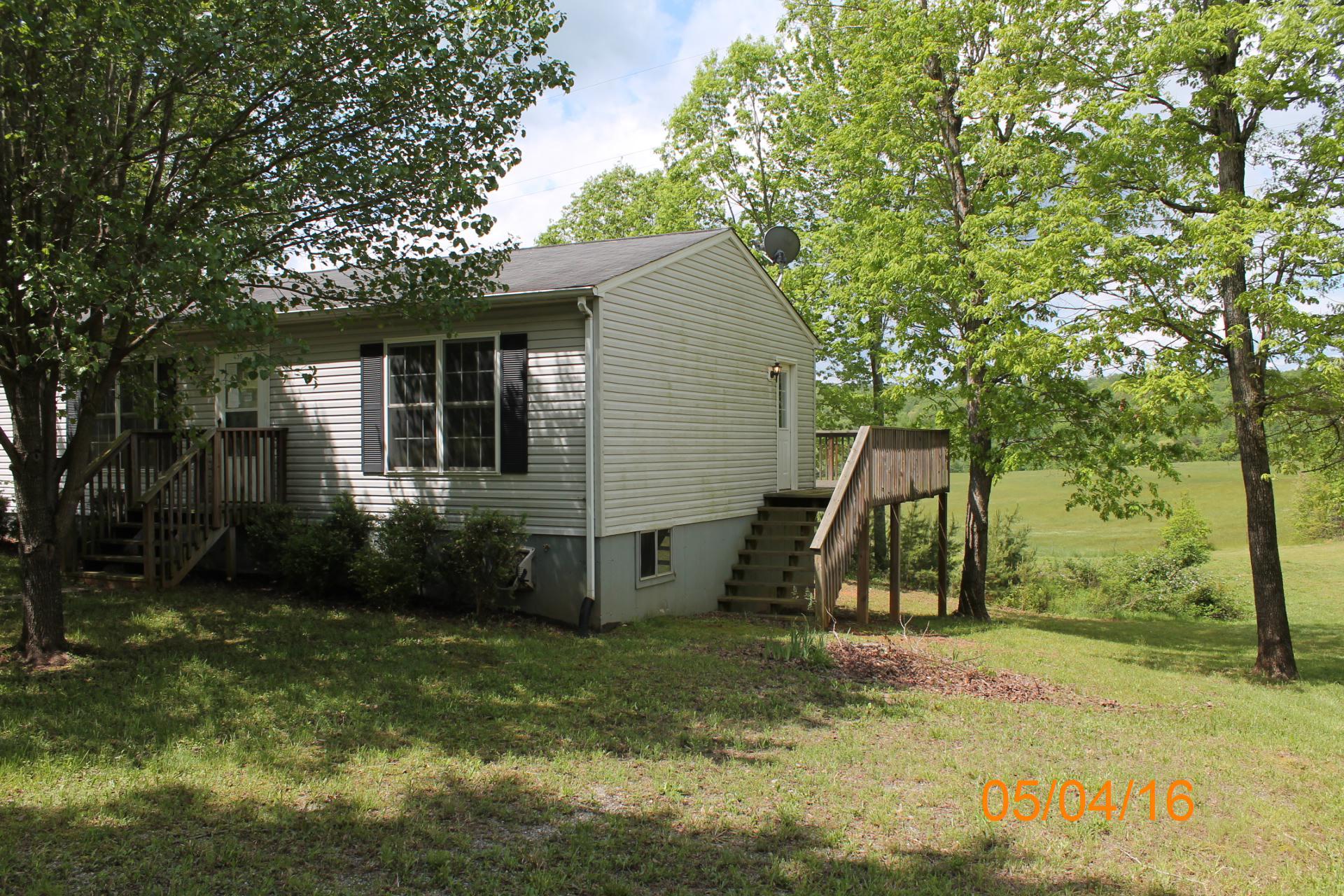 635 Briar Ridge Road Henry, VA 24102 - Photo 2 of 25 a view of a house with a backyard and a tree