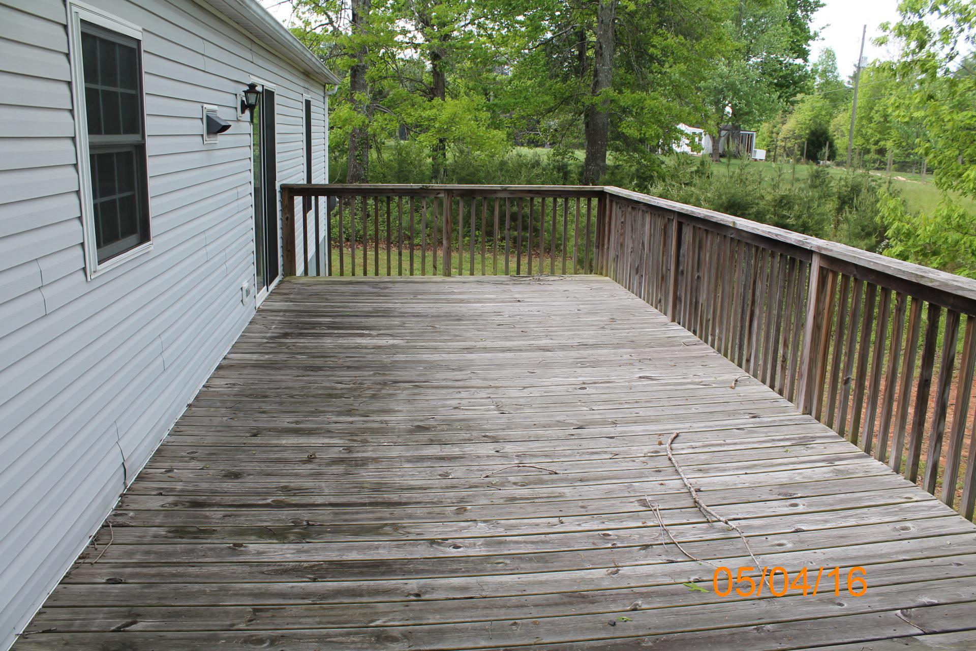 635 Briar Ridge Road Henry, VA 24102 - Photo 15 of 25 a balcony with trees in front of it