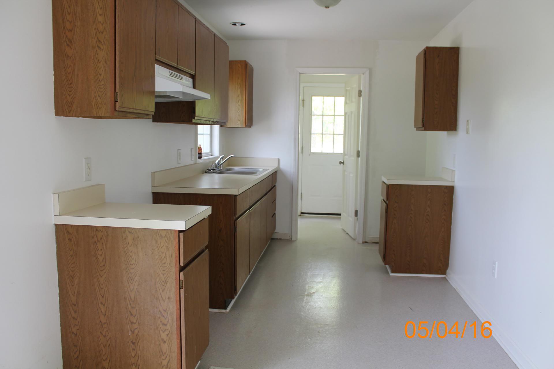 635 Briar Ridge Road Henry, VA 24102 - Photo 8 of 25 a kitchen with a sink a stove and a microwave