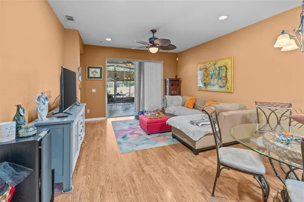 a kitchen with stainless steel appliances granite countertop a sink and a refrigerator