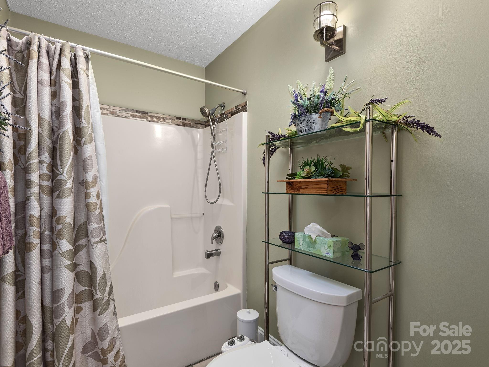 201 Sean Way Hendersonville, NC 28792 - Photo 16 of 24 a bathroom with a shower a toilet and sink