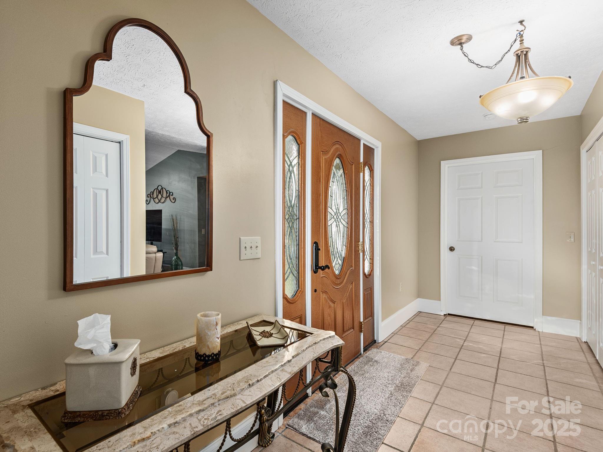 201 Sean Way Hendersonville, NC 28792 - Photo 17 of 24 a view of a room that has a table and chairs in it
