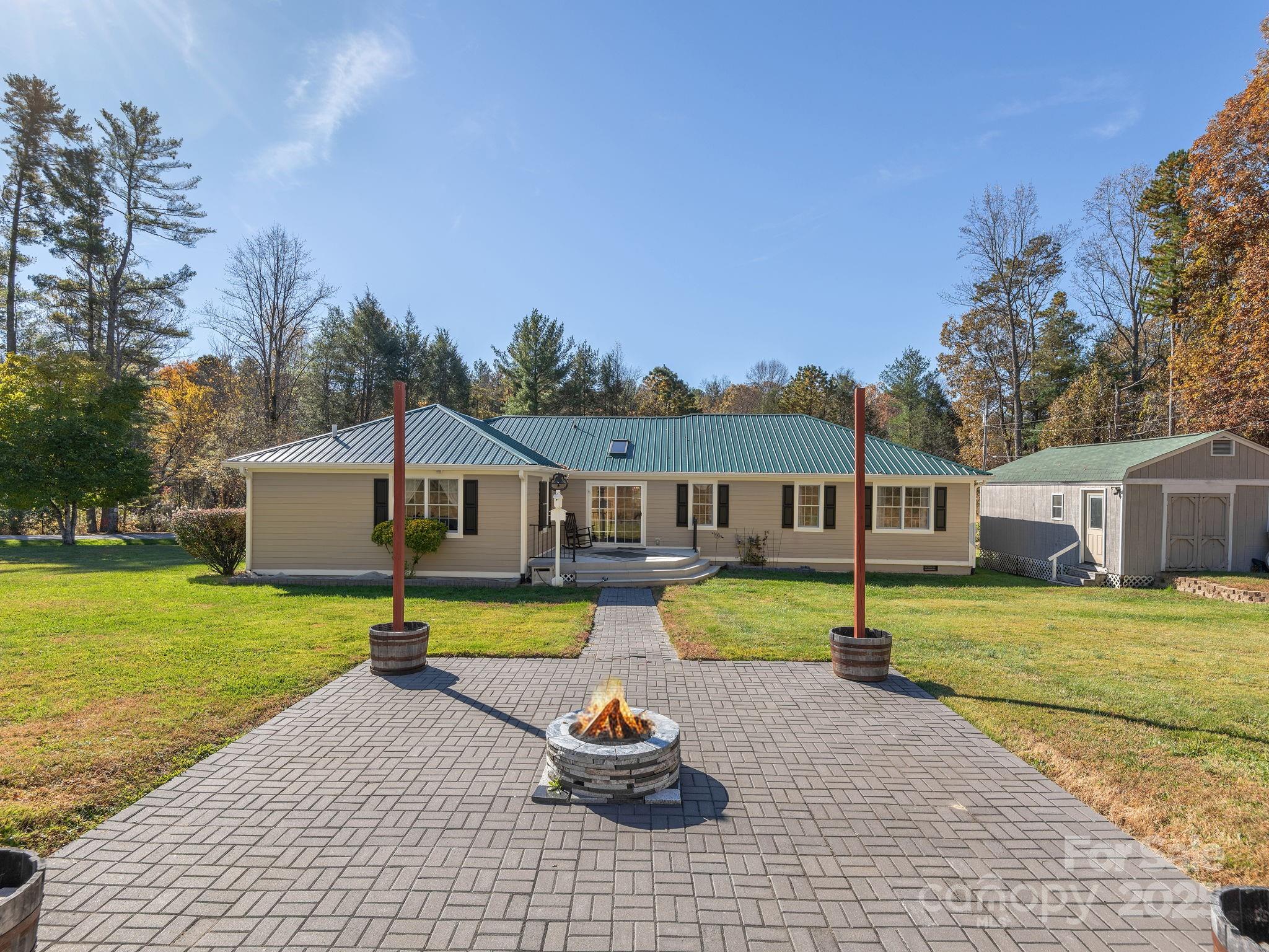 201 Sean Way Hendersonville, NC 28792 - Photo 18 of 24 a front view of house with yard and trees