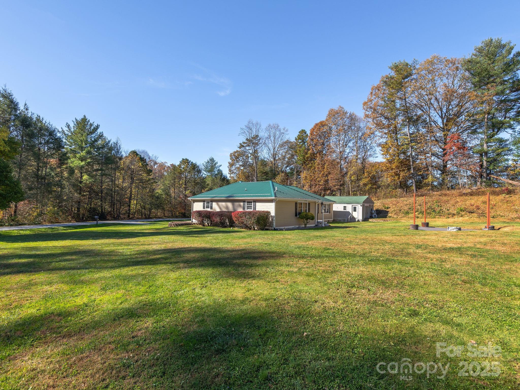 201 Sean Way Hendersonville, NC 28792 - Photo 21 of 24 a front view of a house with a garden