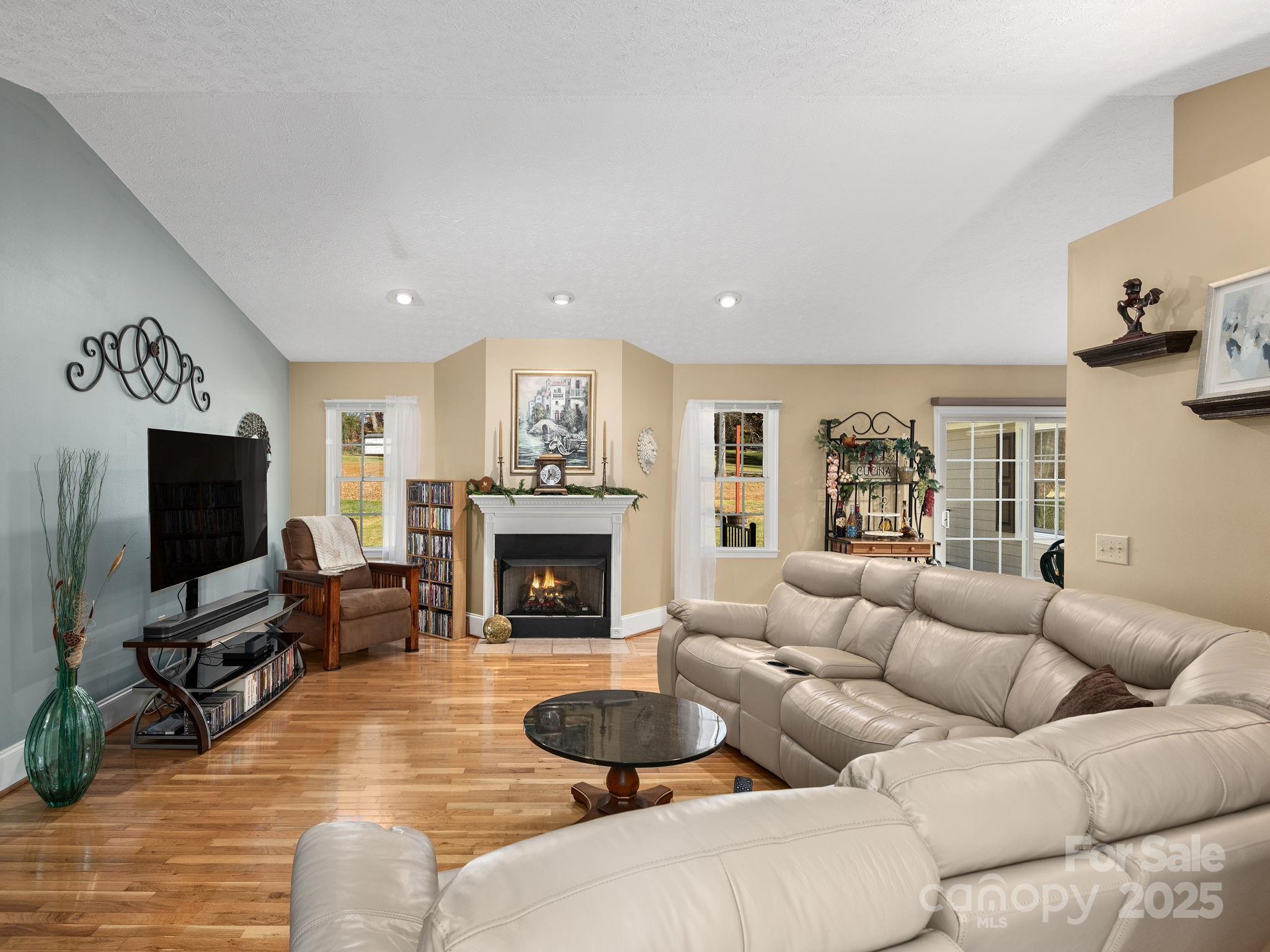 201 Sean Way Hendersonville, NC 28792 - Photo 3 of 24 a living room with furniture and a flat screen tv