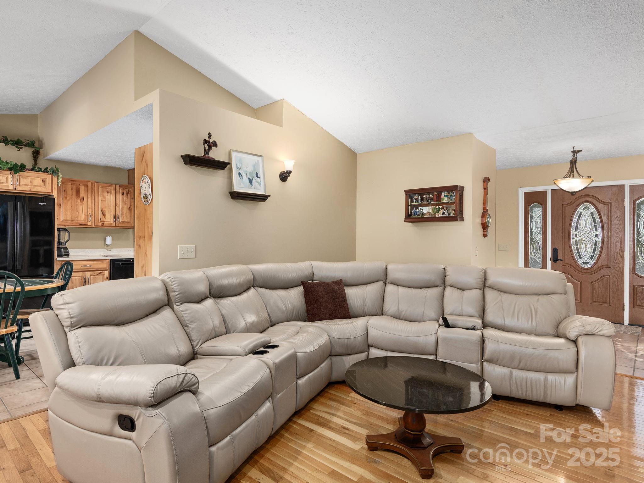201 Sean Way Hendersonville, NC 28792 - Photo 4 of 24 a living room with furniture and a flat screen tv