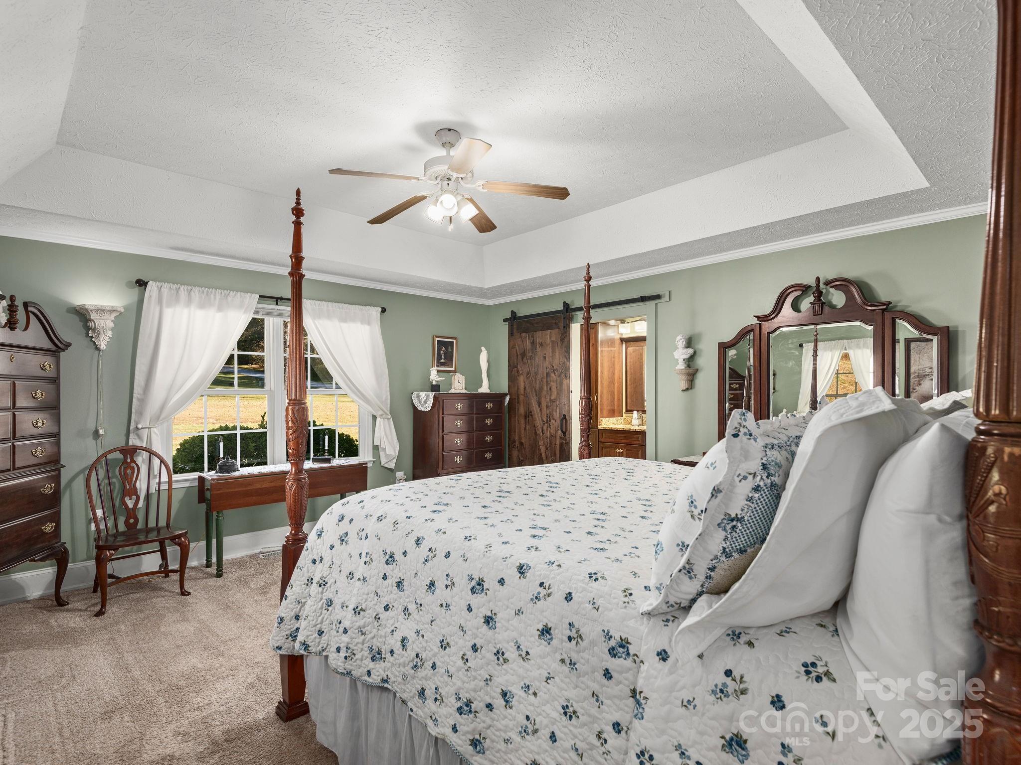 201 Sean Way Hendersonville, NC 28792 - Photo 10 of 24 a bedroom with a bed mirror and a window