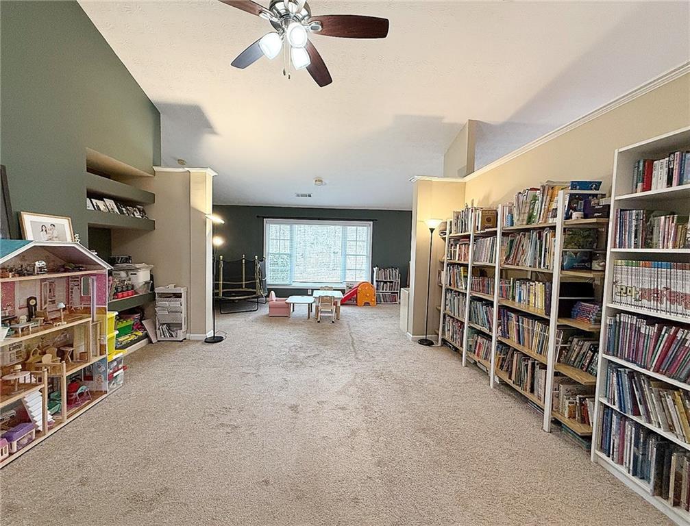 69 Morning Top Court Suwanee, GA 30024 - Photo 15 of 34 a view of a workspace with furniture and toys
