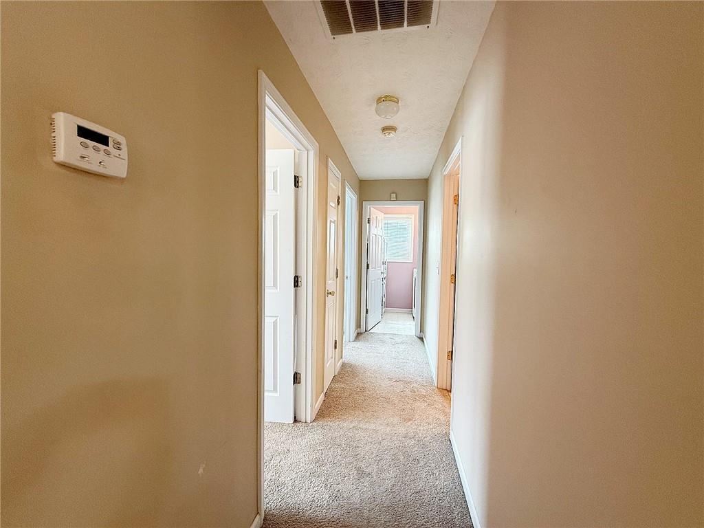 69 Morning Top Court Suwanee, GA 30024 - Photo 24 of 34 a view of a hallway with a hallway