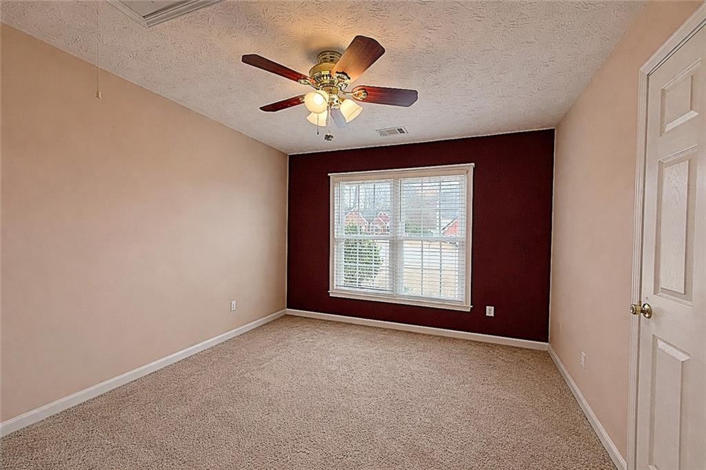 69 Morning Top Court Suwanee, GA 30024 - Photo 25 of 34 a view of an empty room with a window