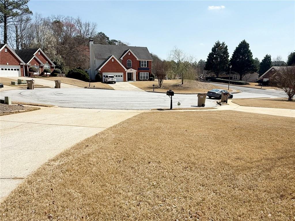 69 Morning Top Court Suwanee, GA 30024 - Photo 34 of 34 a view of the house and outdoor space