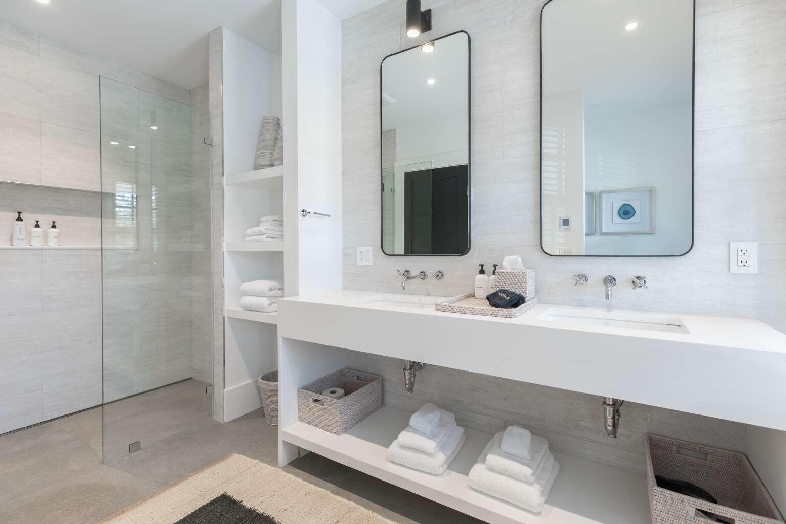 11 A Meadow Lane, Unit B Nantucket, MA 02554 - Photo 14 of 20 a bathroom with a double vanity sink mirror and shower