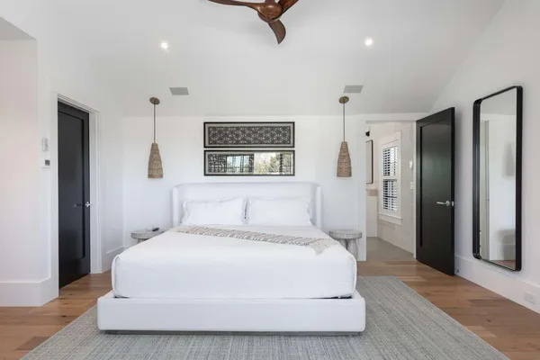 a large white bed in a white room