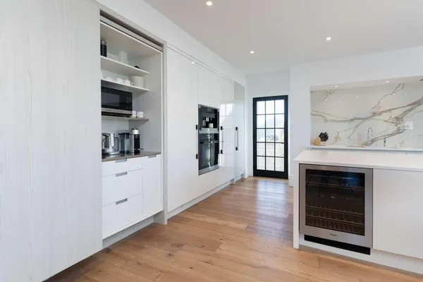 a view of a kitchen with cabinet and a fireplace