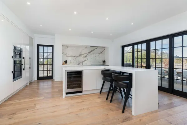 a view of a big room with furniture and windows