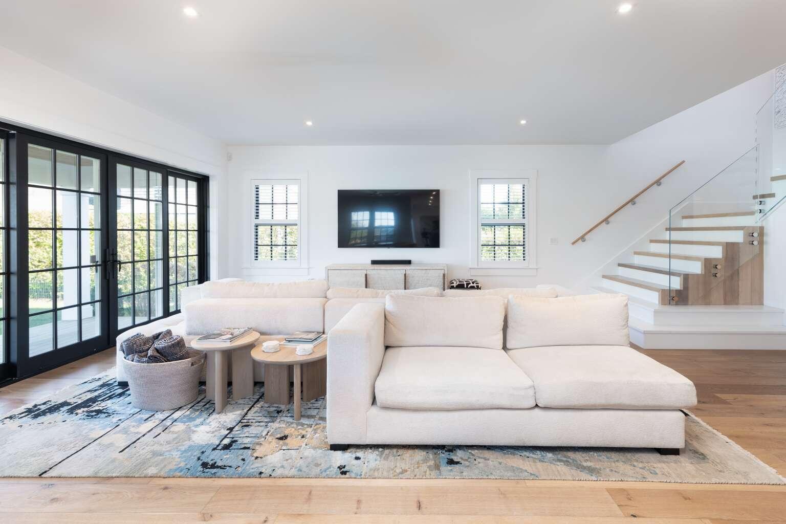 11 A Meadow Lane, Unit B Nantucket, MA 02554 - Photo 7 of 20 a living room with furniture window and a flat screen tv