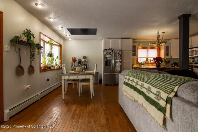 a view of staircase with wooden floor and a potted plant