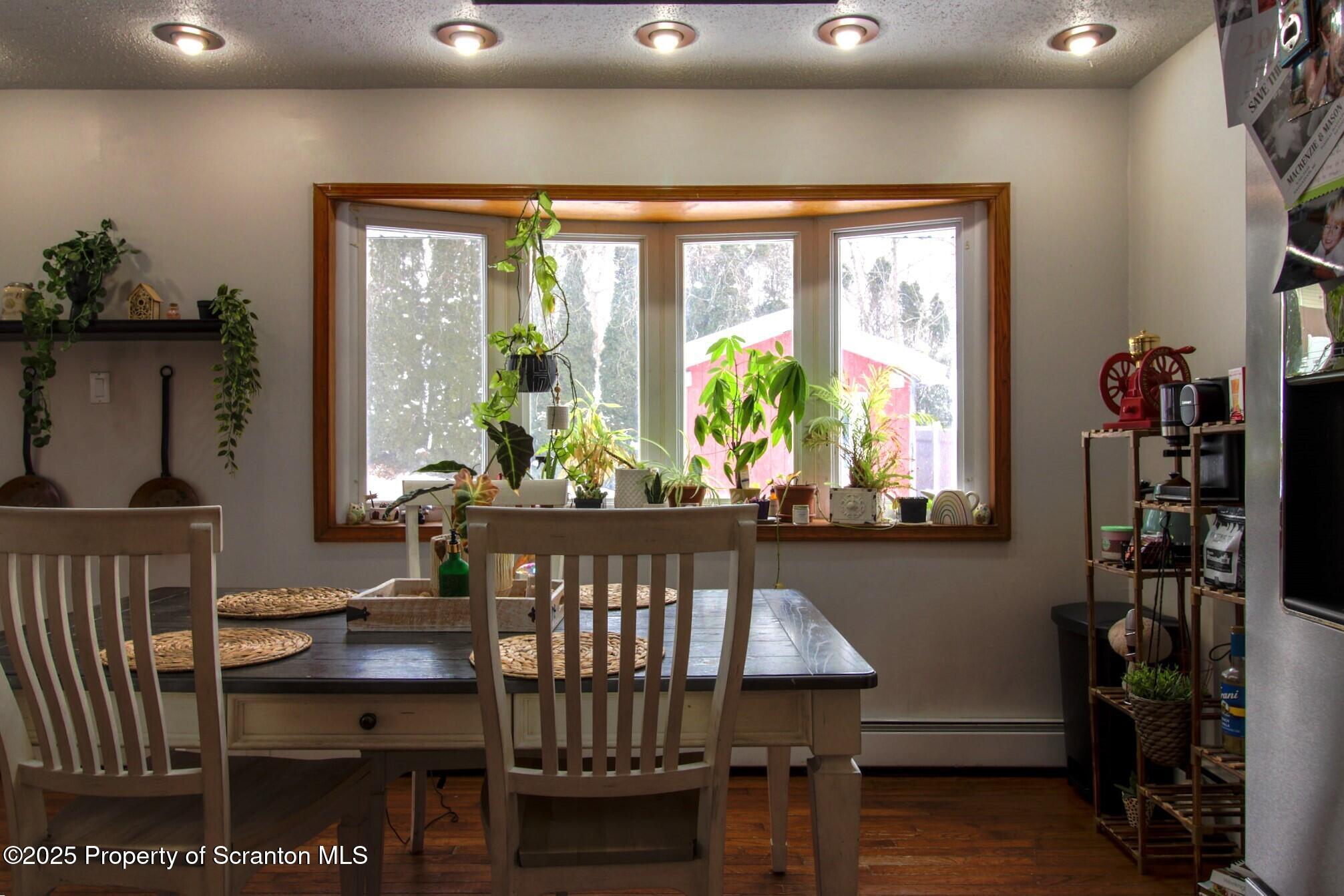 316 Bridge Street Blakely, PA 18452 - Photo 16 of 39 a view of a dining room with furniture and a window